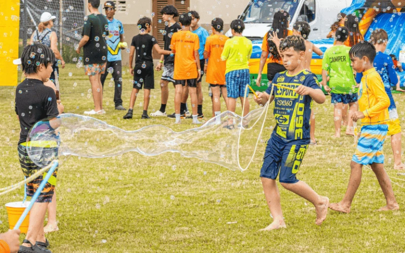 Kids playing bubble games at outdoor event