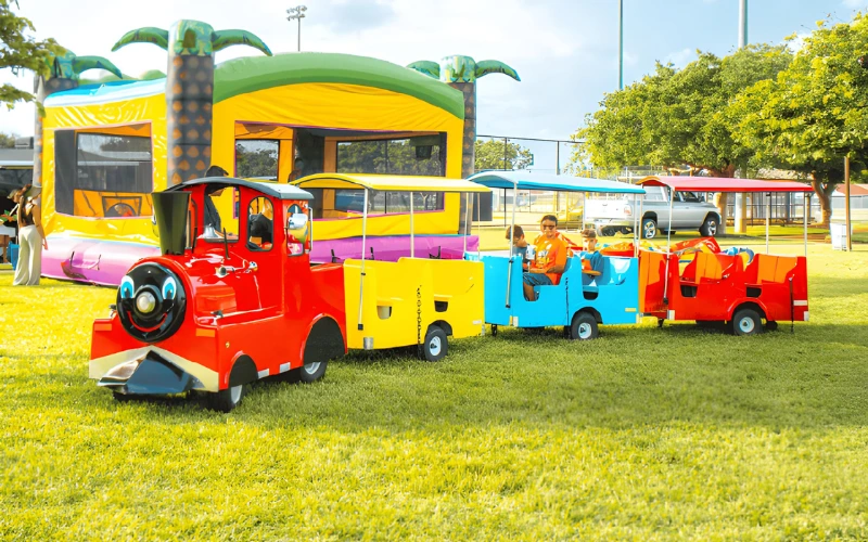 Train ride with tropical bounce house